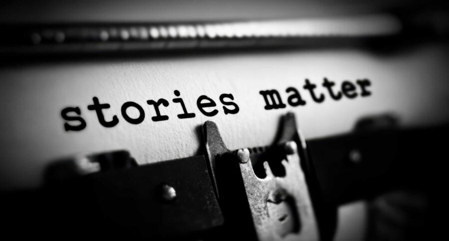 Close-up of typewriter with "stories matter" emphasizing storytelling in content marketing.