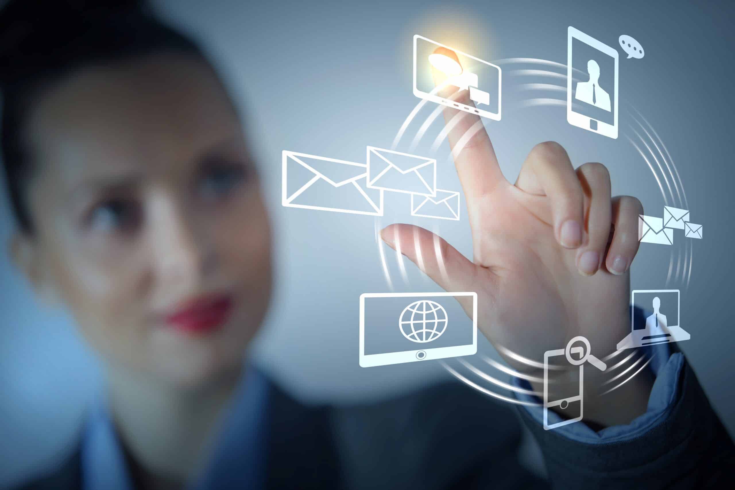 Woman interacting with digital icons representing modern logo design trends.