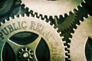 Interlocking gears symbolizing strategic visibility and public relations for business success.
