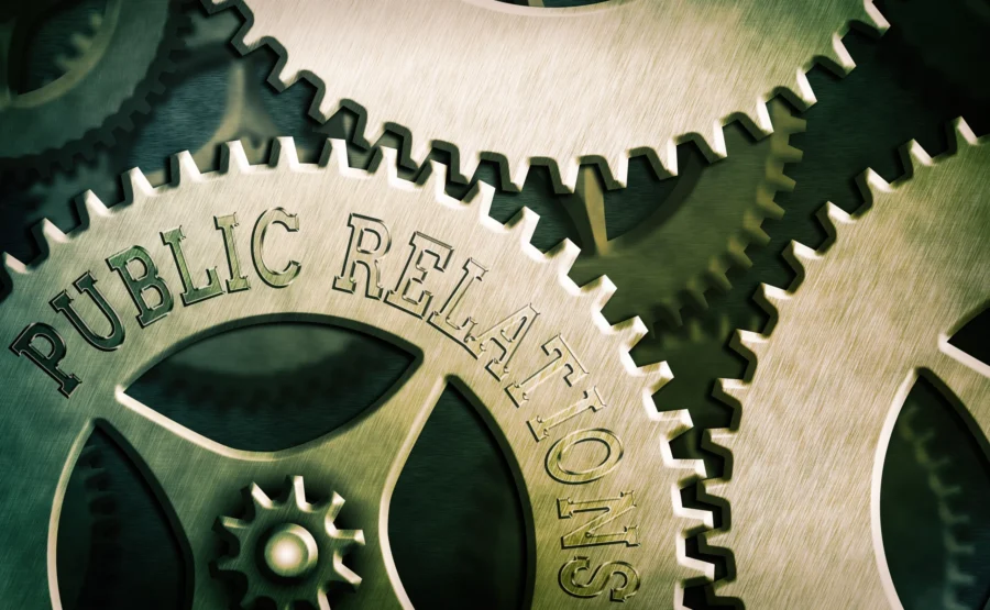 Interlocking gears symbolizing strategic visibility and public relations for business success.
