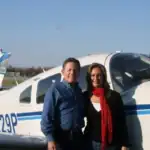 Windward Design Group - Meet Tina Marker Meet Tina Marker, a professional designer at Windward Design Group, standing beside a private jet.